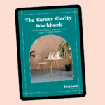 Tablet with page of ebook career transition guide Career Clarity Workbook by Lucy Todd Coaching, featuring the cover with a photo of a white chair and coffee table in a pink room with plants, and a laptop on the table